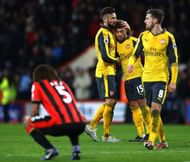 BOURNEMOUTH, ENGLAND - JANUARY 03: Olivier Giroud (2nd L) and Alex Oxlade-Chamberlain (2nd R) of Arsenal embrace at the final whistle during the Premier League match between AFC Bournemouth and Arsenal at Vitality Stadium on January 3, 2017 in Bournemouth, England.  (Photo by Michael Steele/Getty Images)